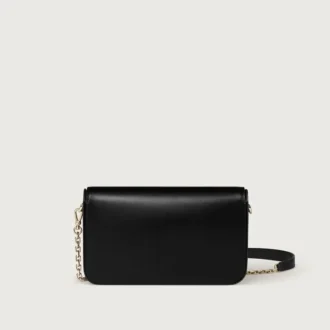 Mini-Kettenhandtasche, Double C de Cartier – Schwarzes Kalbsleder, Gold- und Schwarz-Emaille-Finish – Cartier